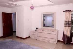 Bedroom and dressing area in the Ruiru villa